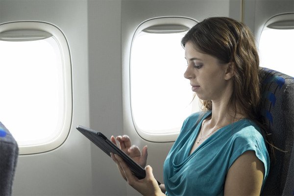 executive-travel-assistant-in-the-air-laptops-and-other-electronic-devices